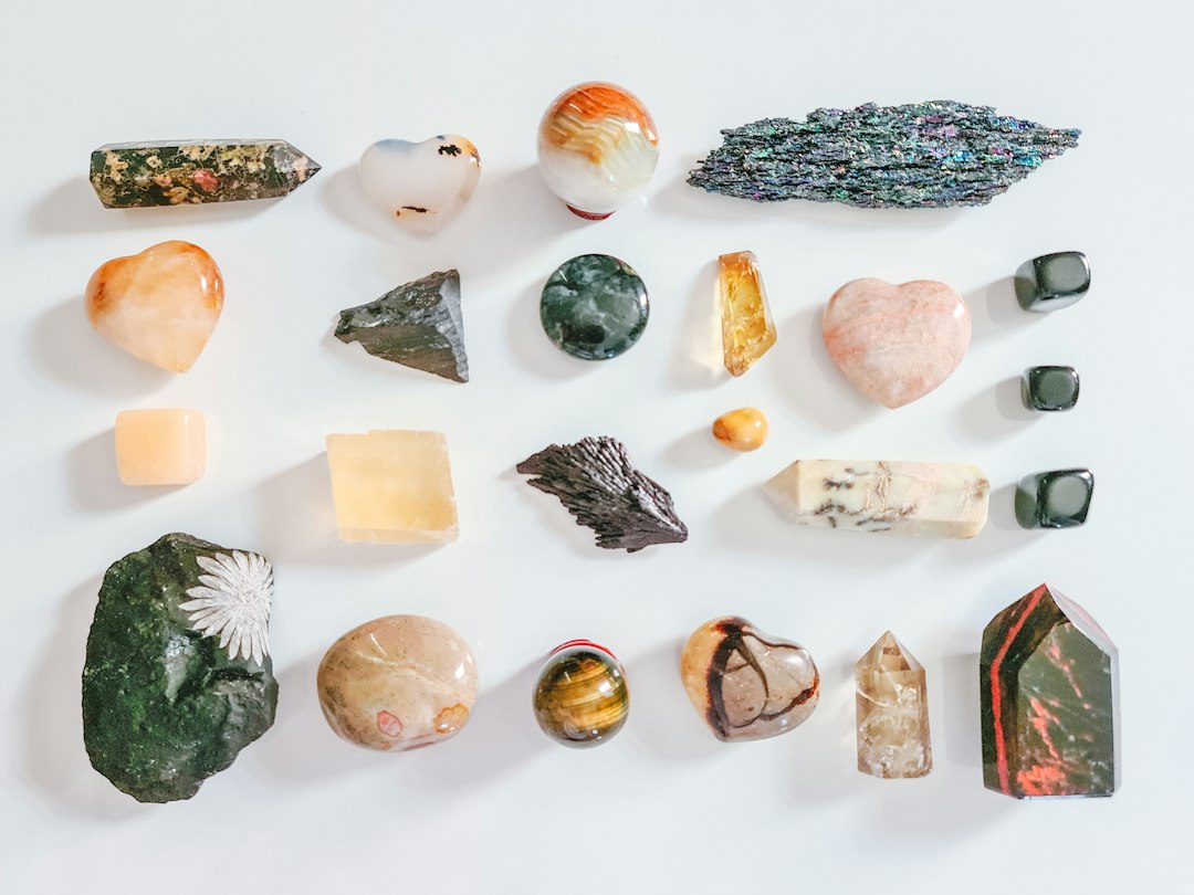 Assorted crystals arranged on a light surface
